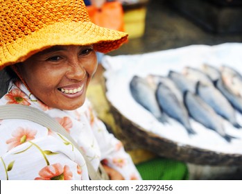 Indigenous Cambodian Woman Selling Fish In A Market. 