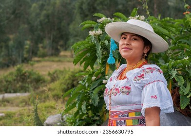 indigenous girl from otavalo, ecuador in traditional dress smiling on the mountain .hispanic heritage month - Shutterstock ID 2356630795
