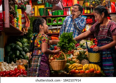 
Indigenous Man Talking On The Cell Phone In A Grocery Store.