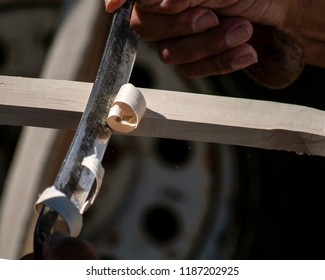 Indigenous Man Working At Making A Wooden Lacrosse Stick