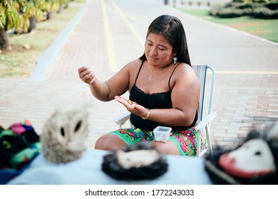 Indigenous Woman Beading Flower Coaster At Souvenirs Stall For Tourists, Ciudad De Panama, Panama