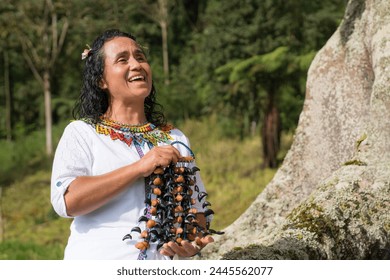 Indigenous-inspired melodies fill the air as women play traditional instruments. A Colombian woman stands serenely, her traditional attire symbolizing wisdom and cultural heritage. - Powered by Shutterstock