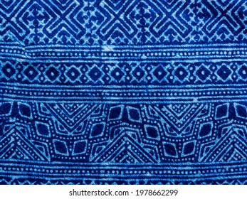 Indigo blue fabric tie dye pattern background. Indigo-Dyed fabric texture with abstract ethnic graphic motif pattern. - Shutterstock ID 1978662299