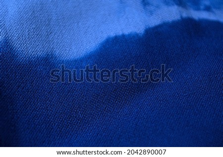 Indigo frame textile background, process dye fabric indigo color, fabric texture close up.