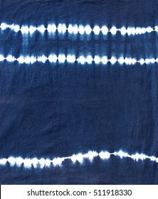 indigo tie dyed pattern on cotton fabric abstract background.

