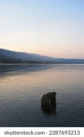 Indiscernible object in Lake Malawi at sunset