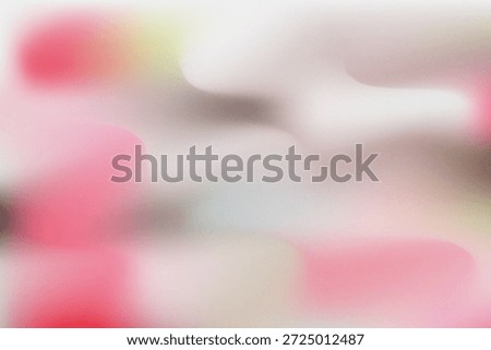 An indistinct, soft-focus image featuring blurred red and white shapes resembling flowers.