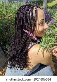 Individual Braids With Black And Purple Colors Model Holding A Purple Mexican Bush Sage Flower Also In The Background Torrance, CA October 2019