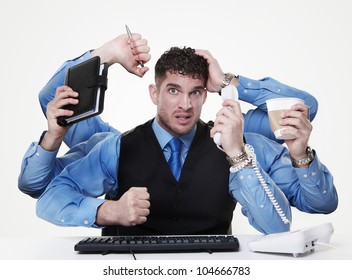 individual businessperson trying to perform and handle more than one task at the same time, not doing very from the looks of things - Powered by Shutterstock