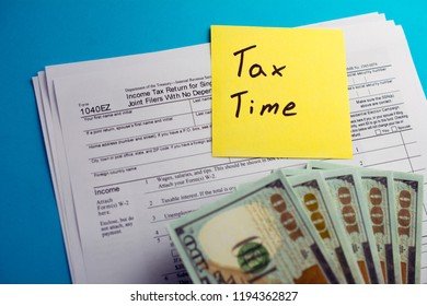 Individual Income Tax Return 1040 Ez Tax Form With Money On Table. Lodging Your Tax Return