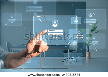 An individual interacts with a high-tech holographic interface in a modern office setting, depicting advanced technology and user interface