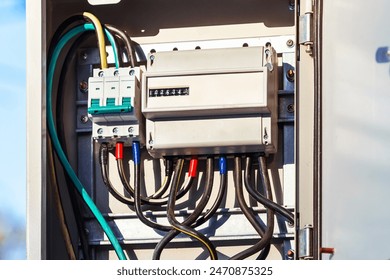 Individual introductory electrical panel. Introductory electrical box with three-phase electricity meter and circuit breakers