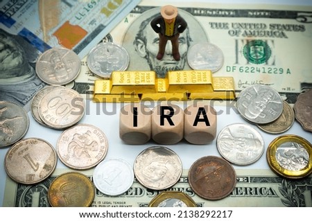 individual retirement account (IRA) is retirement savings accounts with tax advantage.The word is written on money and gold background