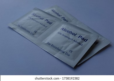 Individual Sachets of Alcohol Wipes Pads, 70% Isopropyl, Close Up on Plain White Background