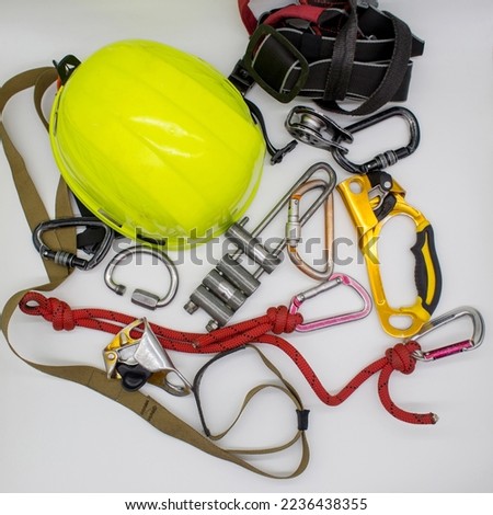 Individual set of SRT (Secure Reliable Transport). Top view of the equipment of a climber, speleologist and alpin. Rope, helmet, steel and aluminum carabiners, ascender, pedal rack descender equipment