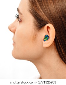 Individual And Stylish Earplugs For Women For Use In The Swimming Pool. Personally Molded Earplugs On Ear Close-up