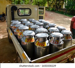 Individually Numbered Stainless Steel Milk Cans Filled With Raw Milk Loaded In A Mini Truck In India