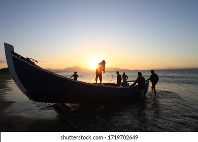 Indonesia, Aceh, 06 January 2020 Traditional Banda Aceh fishermen tidy their nets after anchoring their nets at sea at sunset