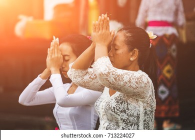 INDONESIA, BALI - July 08, 2017:  People Praying At  Hindu Temple Of Bali.