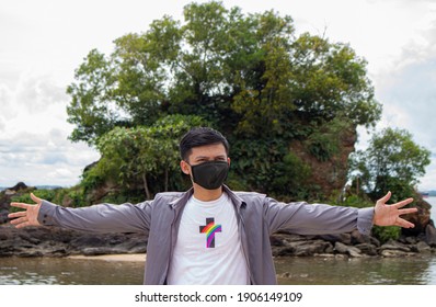 Indonesia, Balikpapan January 28 2021: Masked Man On The Beachside Of Melawai, Balikpapan City With Views Of A Small Island