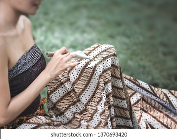 Indonesia batik painting in cotton fabric at Solo. Batik pattern, symbol, clothing and fabric has become a world heritage by UNESCO in 2009. Selective Focus - Shutterstock ID 1370693420