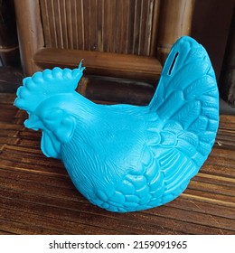 Indonesia Calls It CELENGAN. This Blue Piggy Bank Is Made Of Plastic And Is Shaped Like A Chicken With A Hole In The Tail To Put Money In. Kids Love It As A Place To Keep Money At Home