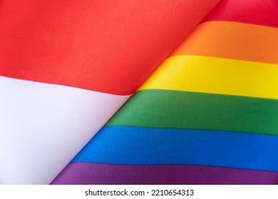 Indonesia Flag And Flag Of LGBT Community. Problem Of The Rights Of Sexual Minorities In The Country. Protection And Infringement Of Human Rights. Non-traditional Relations And Politics Concept.