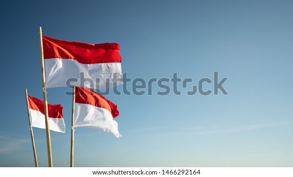 indonesia\
flags under blue sky independence day\
concept