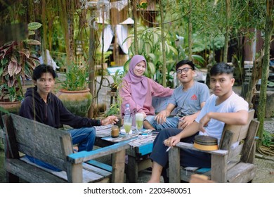 Indonesia, Makassar - September 13, 2022 : A Group Of Teenagers Hanging Out At Warkop