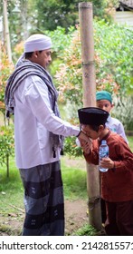 
Indonesia, March 03, 2022, A Religious Leader Praying For His Students