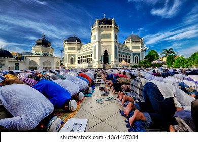Indonesia, Medan - June 15, 2018 : crowded muslims Worshiping Eid al-Fitr is also known as Hari Raya idil Fitri at masjid Raya Mosque, one of the oldest and the famous mosque in Medan, Indonesia