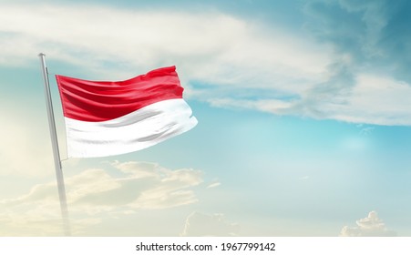 Indonesia National Flag Waving In Beautiful Sky.