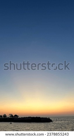 Indonesia Origin, Manado City, North Celebes Sea at Sunset with Blue and Orange Sky