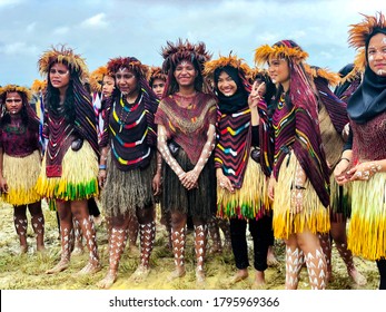 INDONESIA, PAPUA NEW GUINEA, WAMENA, IRIAN JAYA, 20 AUGUST 2018: Young girls of a papuan tribe in a beautiful crown from bird feathers on Baliem Valley festival in Wamena, Papua New Guinea.