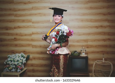 INDONESIA, Pontianak - January 29, 2020: Photo Studio - Beautiful Student Woman In Javanese Traditional Dress (Graduation Photo) 
