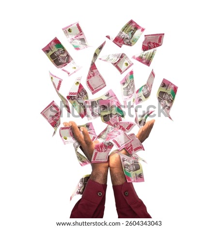 Indonesia Rupiah notes falling in black male hands isolated on white background. 3d rendered banknotes