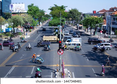 Indonesia, Surabaya - July 9 2019: One of Main street in Surabaya city called Darmo Street. Noon is its rather busy hour of traffic.