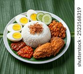 Indonesia Traditional Food, Nasi Uduk With Fried Chiken and Spicy chili