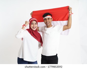 indonesian couple celebrating indonesia independence day together over white background