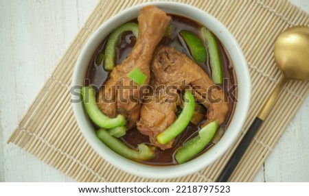 Indonesian cuisine chicken drumsticks stewed with potatoes in spicy sweet soy sauce known well as semur in selective focus