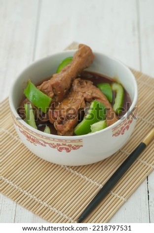 Indonesian cuisine chicken drumsticks stewed with potatoes in spicy sweet soy sauce known well as semur in selective focus