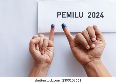 indonesian election 2024 concept.  finger with an ink mark on the little finger.indonesian election 2024 concept.  finger with an ink mark on the little finger.  presidential election in Indonesia