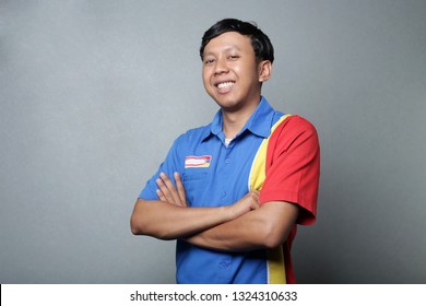 indonesian face smiling with cross arms. handsome indonesian man smile.