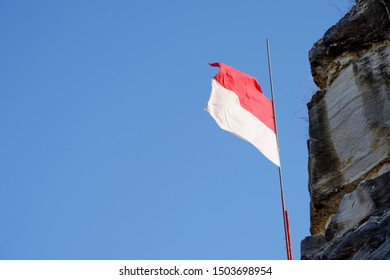 Indonesian flag on the blue sky background. - Shutterstock ID 1503698954