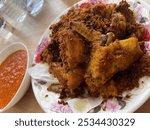 Indonesian food "Fried chicken kalasan" with sambal