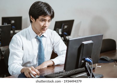 Indonesian High School Students Smile While Using A Computer Pc