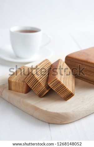 Indonesian layered cake and cup of coffee with white background Stock photo © 