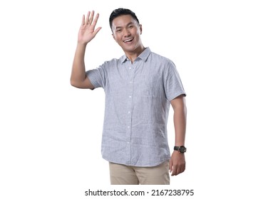 Indonesian Man On White Background SMiling And Giving Hi Five