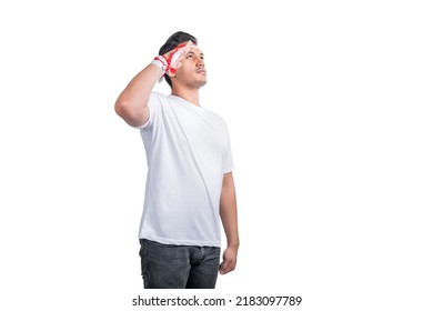 Indonesian men celebrate Indonesian independence day on 17 August with respectful gestures isolated over white background