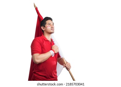 Indonesian men celebrate Indonesian independence day on 17 August by holding the Indonesian flag isolated over white background - Shutterstock ID 2185703041
